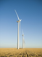Row of windmills on wind farm. Date : 2008