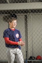 Baseball player standing in dugout. Date : 2008