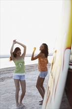 Young women dancing on beach. Date : 2008