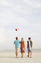 Friends walking on beach. Date : 2008