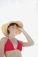 Young woman in bikini, protective hat and sunglasses. Date : 2008