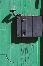 Close up of old door latch in Prague.