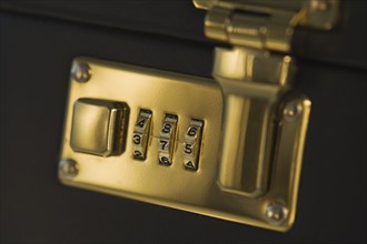 Close up of briefcase lock.