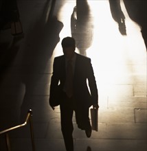 Businessman climbing steps at Grand Central Station. Date : 2008