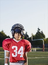 Football player standing on field and looking serious. Date : 2008