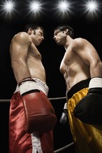Boxers facing off in boxing ring. Date : 2008