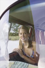 Woman sitting in passenger seat of van. Date: 2008