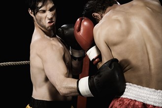 Boxers fighting in boxing ring. Date : 2008