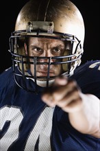 Football player pointing and looking intense. Date : 2008