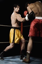 Boxers fighting in boxing ring. Date: 2008