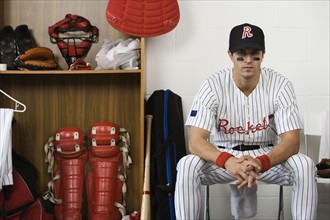 Portrait of baseball player sitting in locker room. Date: 2008