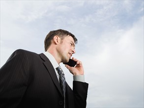 Close up of businessman talking on cell phone. Date : 2008