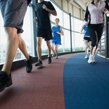 Runners on indoor track. Date: 2008