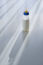 Milk in baby bottle.