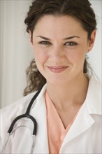 Close up of smiling female doctor.