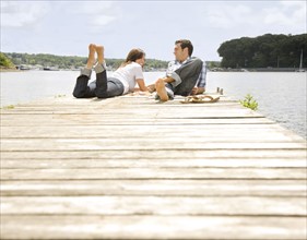 Couple laying on dock. Date: 2008