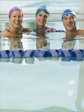 Man and women posing in swimming pool. Date : 2008