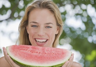 Woman eating watermelon.