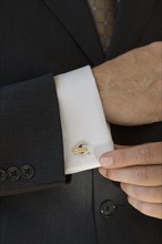 Close up of businessman with euro cuff link.