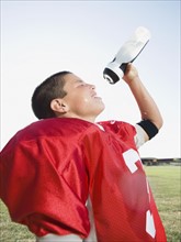 Football player spraying water on face. Date : 2008
