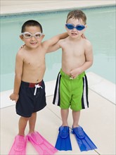 Boys in flippers posing by swimming pool. Date : 2008