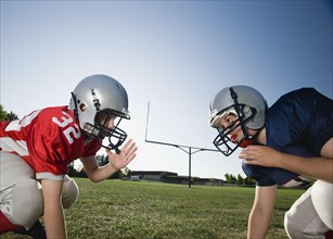 Opposing football players facing at line of scrimmage. Date: 2008