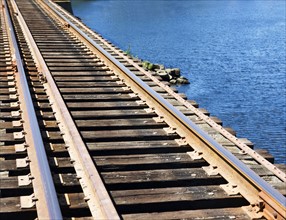 Train tracks at water’s edge. Date: 2008