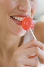 Close up of woman with lollipop.