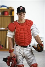 Portrait of baseball catcher in locker room. Date : 2008