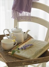 Tray with tea, lavender, and journal.