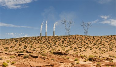 Power plant in distance on Navajo reservation in Arizona.