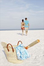 Couple walking on beach. Date: 2008