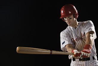 Baseball player swinging bat. Date: 2008