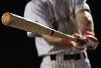 Close up of baseball player swinging bat. Date: 2008