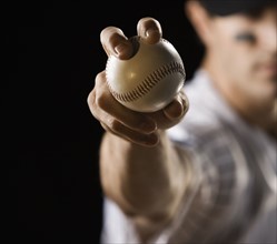 Close up of pitcher holding baseball. Date : 2008