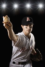 Portrait of pitcher throwing baseball. Date: 2008