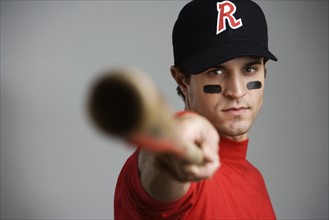 Close up of baseball player pointing bat. Date : 2008