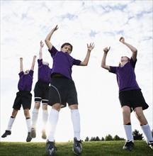 Boys soccer team celebrating on field. Date: 2008