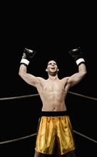 Boxer celebrating in corner of boxing ring. Date : 2008