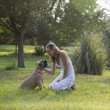 Woman and dog in park. Date: 2008