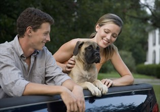 Couple and dog in back of truck. Date : 2008