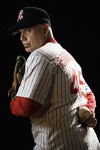 Pitcher holding baseball behind back. Date: 2008