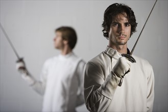 Portrait of fencers holding fencing foils. Date : 2008