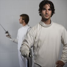 Portrait of fencers holding fencing foils. Date : 2008