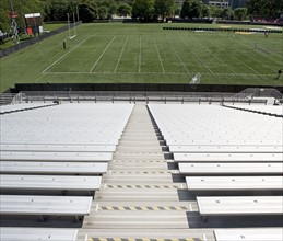 View of football field from empty bleachers. Date: 2008
