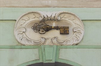 Gold key plaque to identify house, Prague.