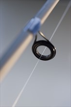 Close up of fishing line on pole.