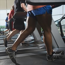 Men running on treadmills. Date: 2008