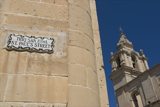 St. Paul’s Street sign and Mdina Cathedral, Malta.