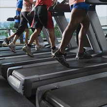 Men and woman running on treadmills. Date : 2008